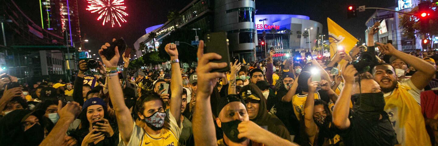 Los Angeles Lakers fans gather near the Staples Center to celebrate the Lakers 106 - 93 game 6 over the Miami Heat on Sunday, Oct. 11, 2020 in Los Angeles. | Jason Armond / Los Angeles Times via Getty Images