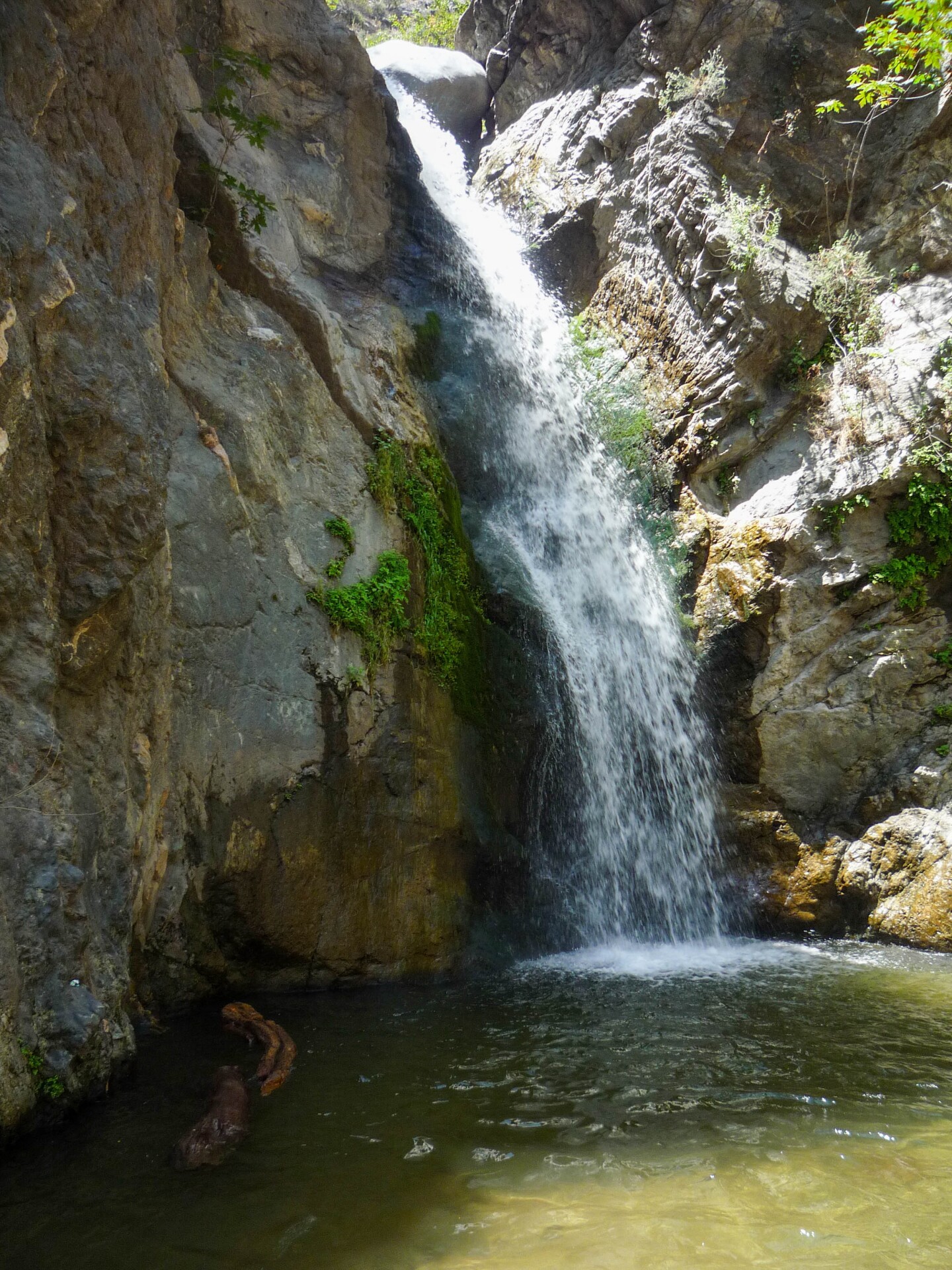 The waterfall at Eaton Canyon empties into a pool of water at the foot of the falls where hikers will frequently swim.