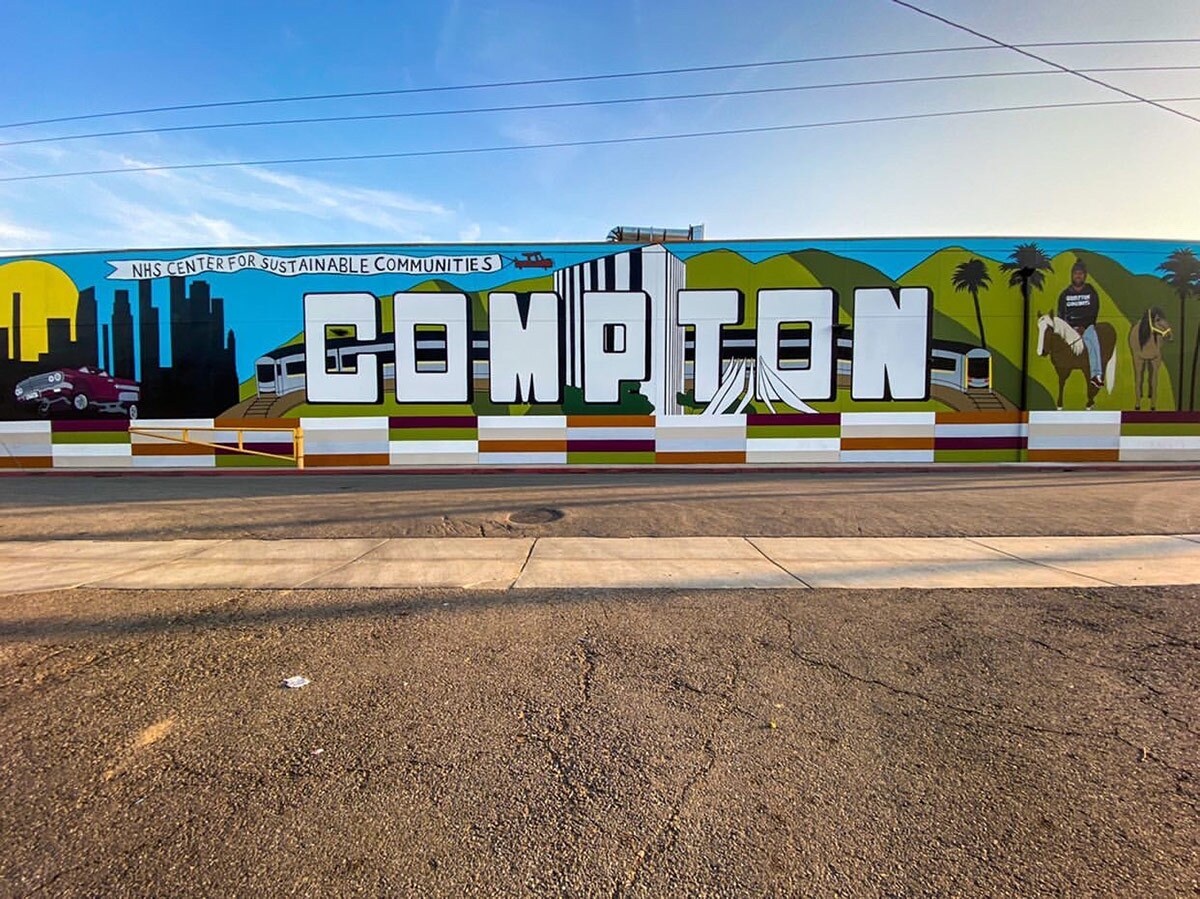 The recent “Compton” mural painted by local artists Anthony Pittman and Mel Depaz evokes Pinkney’s legacy of murals that reflect the community’s culture and pride. | Courtesy of Monica Serrano