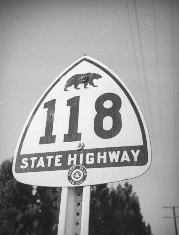 The shield's original 1934 design featured the silhouette of a grizzly bear, present on the state flag but extinct in California since 1922. Photo by Herman Schultheis, courtesy of the Photo Collection - Los Angeles Public Library.