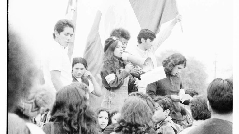 CSRC_LaRaza_B15F10C1_Staff_025 Protesters at Franklin D. Roosevelt Park rally | Maria Marquez Sanchez, La Raza photograph collection. Courtesy of UCLA Chicano Studies Research Center