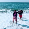 Californians for Justice youths at the beach and playing in the water. It is a rare experience for many to just be able to relax since many are juggling multiple responsibilities created by social and economic systems. | Californians for Justice