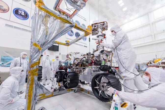 On June 13, 2019, engineers at JPL install the starboard legs and wheels — otherwise known as the mobility suspension — on the Mars 2020 rover | NASA/JPL-Caltech