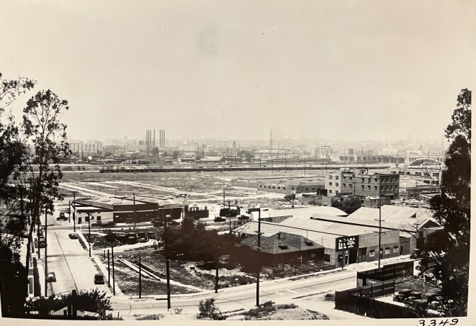 Photographed from the bridge's abutment on the east side, this photo shows the flats of Boyle Heights while looking west across the river. 