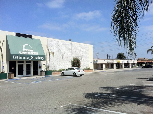 West Coast Islamic Society -- next to the handicap spot a sign reads 'Imam parking only'
