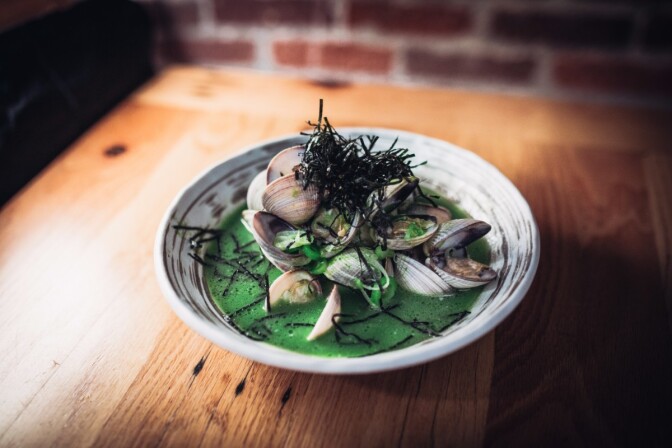 Tsubaki's Asari Saka-Mushi: Sake-steamed Baja clams, green garlic dashi | Courtesy of Life & Thyme