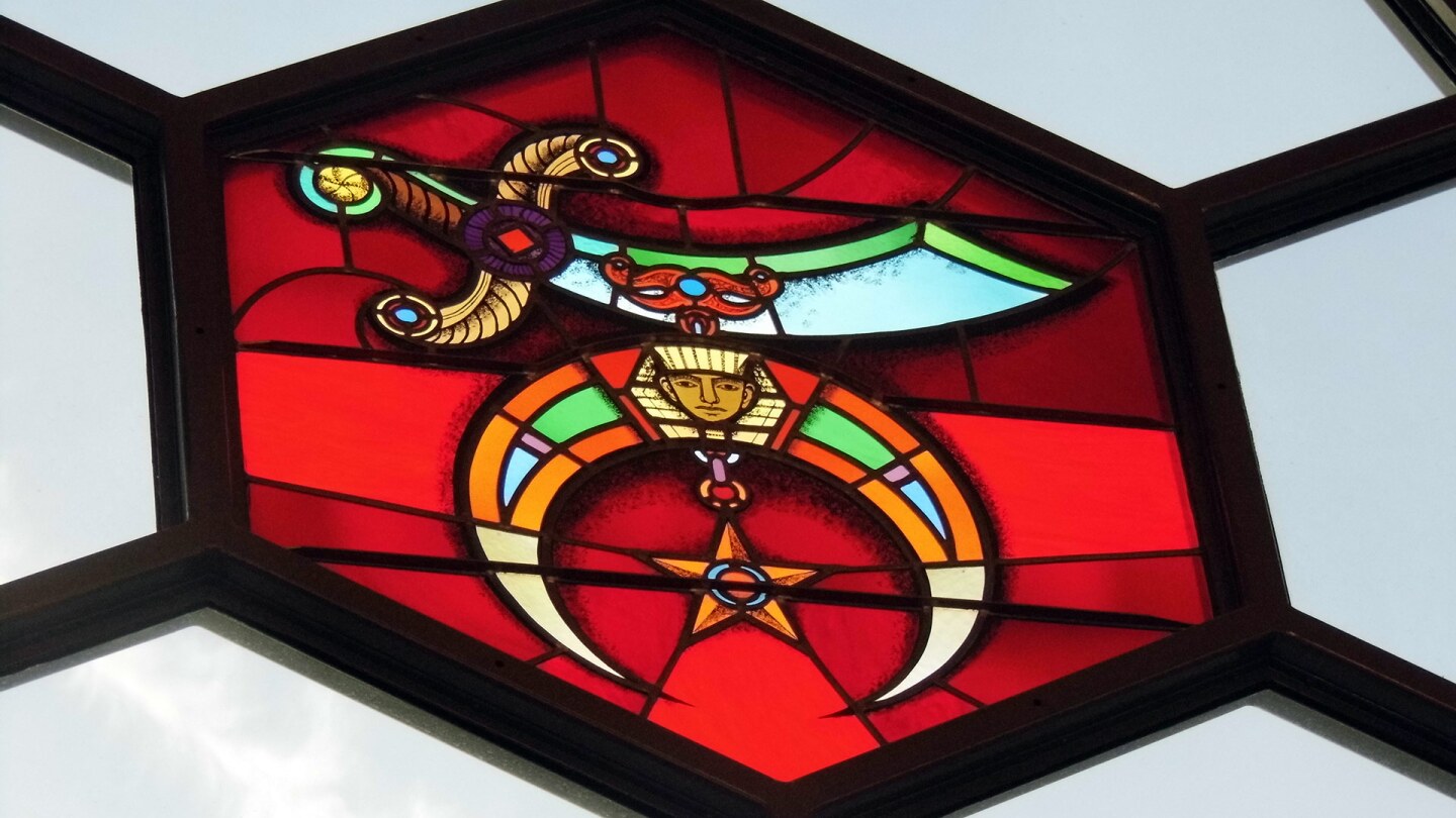 The Shriners emblem is a scimitar with a crescent made of two claws embellished with a sphinx head and a five-pointed star. | Sandi Hemmerlein