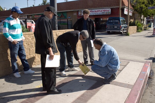 Streetscape architect Korajack Srivongse who was educated at Thammasat University in Thailand marks part of the sidewalk on Hollywood Blvd. and Hobart Blvd. where the Kinarra will be installed | Photo by Curtis McElhinney