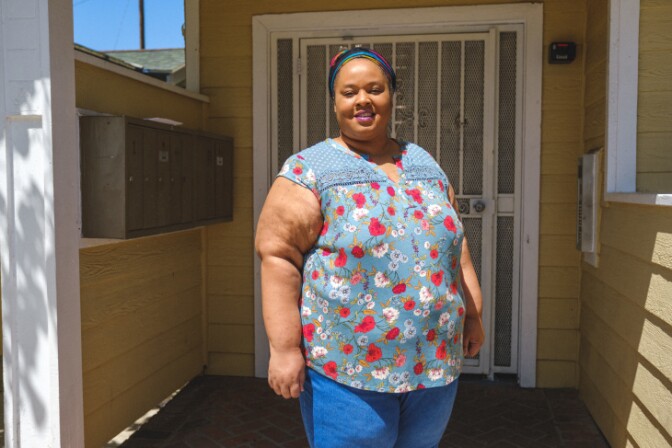 Monique Cowan, a doula in L.A. County, photographed outside of her home, where she now does most of her work remotely. | Chava Sanchez/LAist