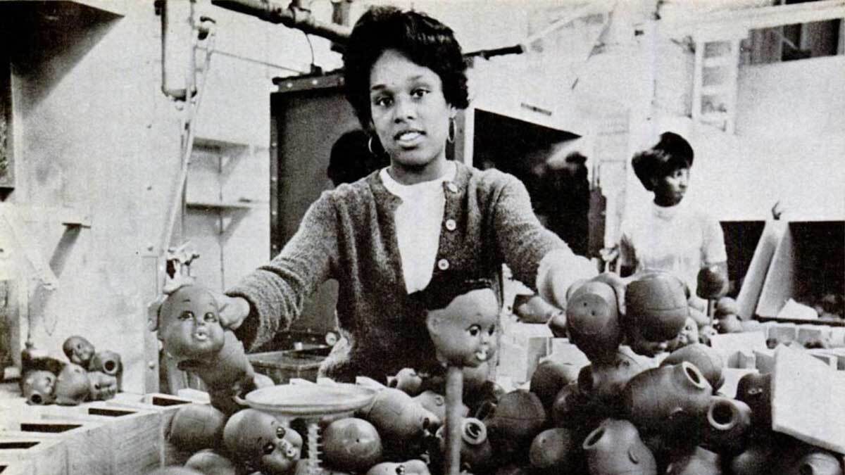 A woman manufacturing Shindana Toy dolls from a Jet Magazine story published by Johnson Publishing Company | Still from "Lost LA" Shindana Toys