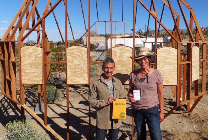 Bernard Leibov and Danielle Segura hold "Reading the Landscape" resources
