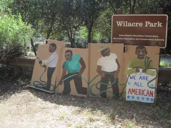 Cut outs for President Obama's visit to L.A. are in a 'designated public area' (aka protesters area) in front of Wilacre Park.