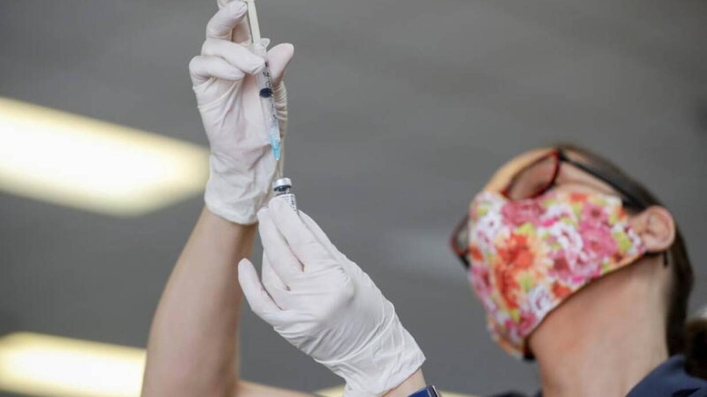 A Florida Department of Health worker prepares a dose of the Pfizer-BioNTech COVID-19 vaccine to be administered at the historic Greater Bethel Missionary Baptist Church in Tampa, Florida, U.S. February 14, 2021.