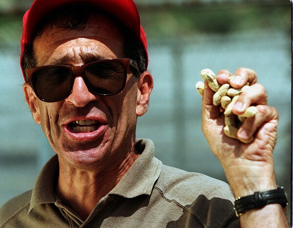 Richard Aller, peanut vendor, holds a fistful of roasted nuts | Photo by Kirk McKoy/Los Angeles Times via Getty Images