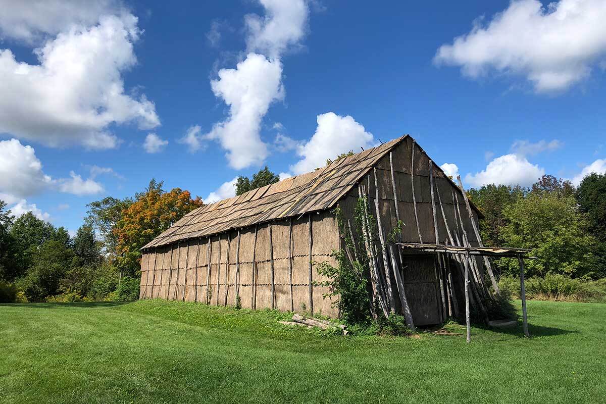 The longhouse at Ganondagan, the Seneca village in present-day Ontario County, New York, that the French burned to the ground during a fur-trade dispute in 1687. Today, is a historic site and cultural center. | Paige Bardolph