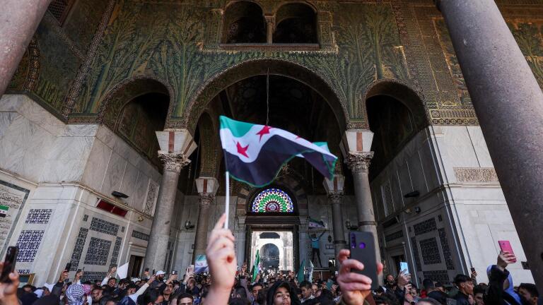 Syrians jubilant in first Friday prayers after Assad