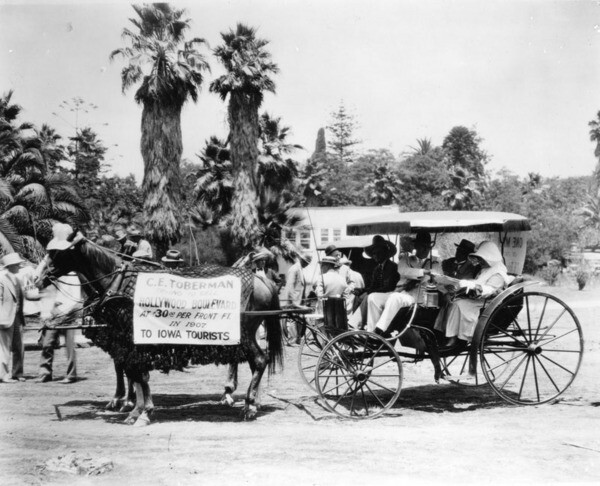Hollywood Old Settlers Parade in 1927 included this entry, with banner on horse that reads 'C.E. Toberman trying to sell Hollywood Boulevard at $30.00 per Front Ft. in 1907 to Iowa Tourists' | Courtesy of the Los Angeles Public Library