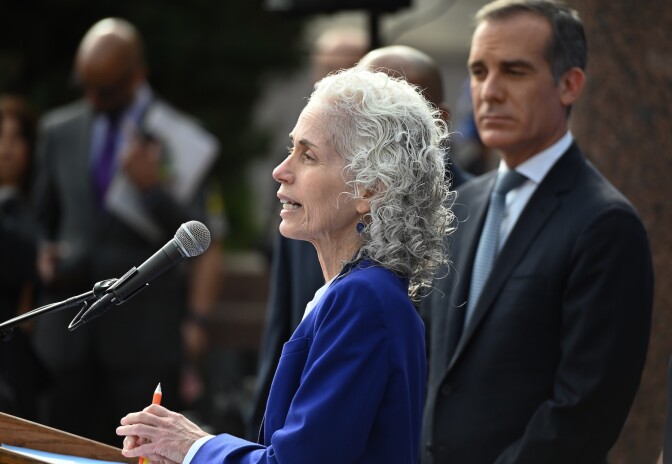 Los Angeles County Public Health director Barbara Ferrer speaks as Los Angeles Mayor Eric Garcetti (R) looks on at an Los Angeles County Health Department press conference on the novel coronavirus, (COVID-19)