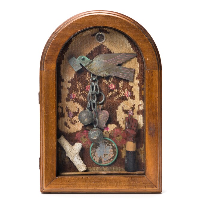 Betye Saar's piece "Sojourn" depicts a carrier bird being weighted down by a ball and chain and a heart.