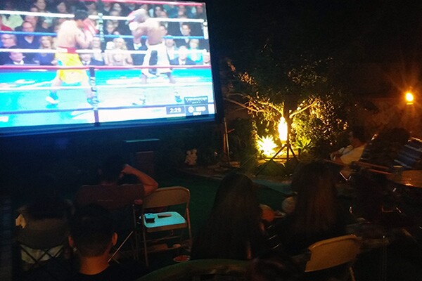 Across Southern California, Filipinos staged fight night parties, such as this one in the backyard of the Sayo residence in Sun Valley. | Photo: Elson Trinidad