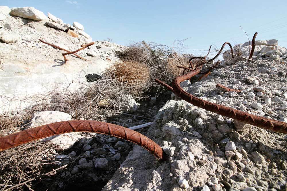 Bent rebar and broken concrete at Taylor Yard | Courtney Cecale