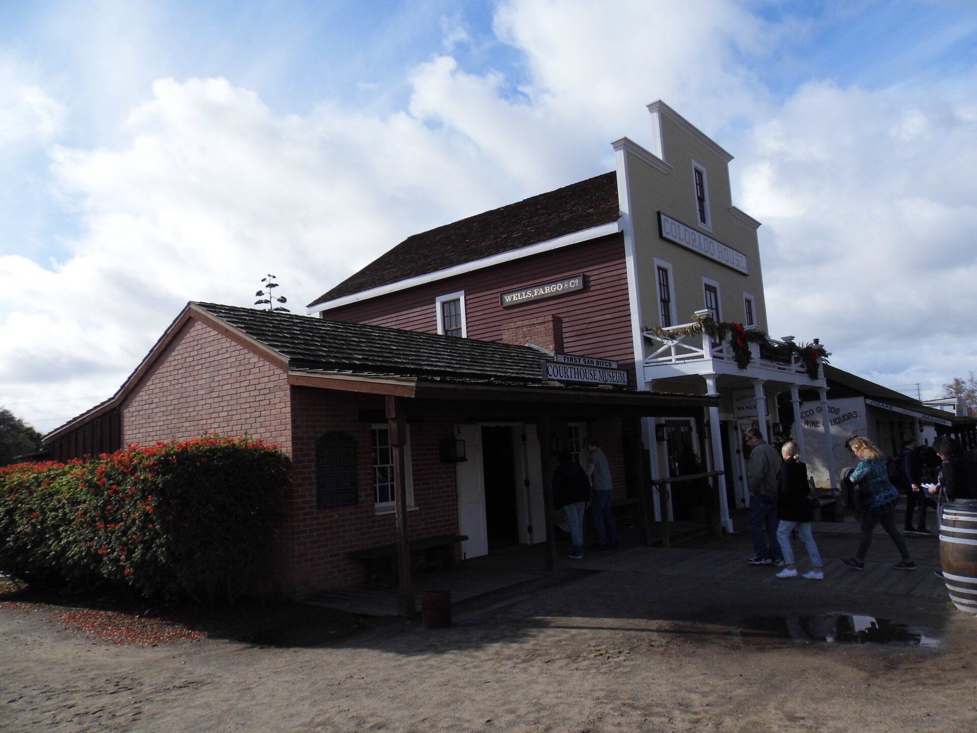 Two Old West-style buildings, one with a sign that reads, "Courthouse Museum" and another that reads, "Colorado House" stand side-by-side. 