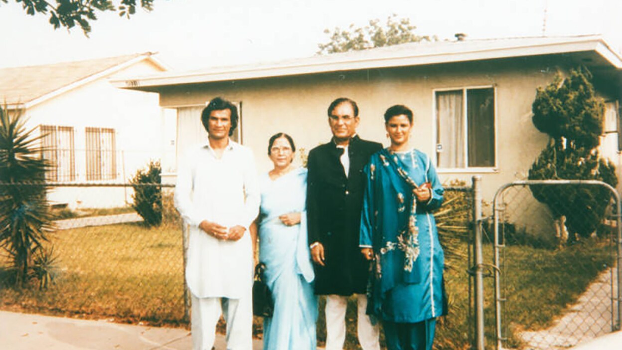 Syed and Qaiser with their children Qamar and Faozia in front of a home in Los Angeles. | Shades of L.A. Collection / LAPL