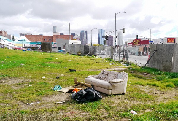 A lone couch occupies the land that once housed hundreds of residents and visitors | Photo by Yosuke Kitazawa