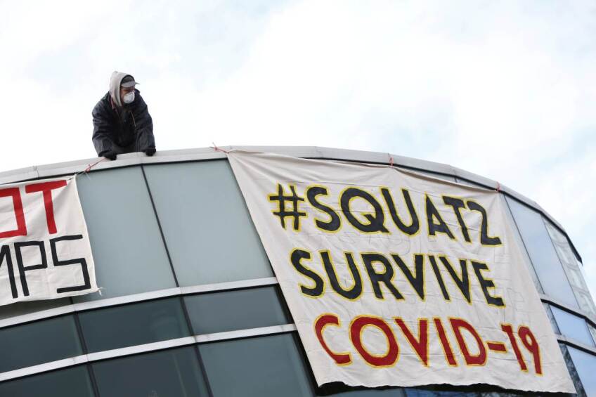People squat in an empty community center to protest what they describe as a lack of support for the homeless against the coronavirus disease (COVID-19) in Surrey, British Columbia, Canada April 1, 2020. 