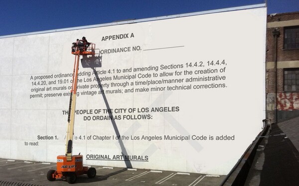 Writing on the wall, a digitally illustrated mock mural I Photo Ilustration by Ed Fuentes. Base photo courtesy of Jet Set Graffiti