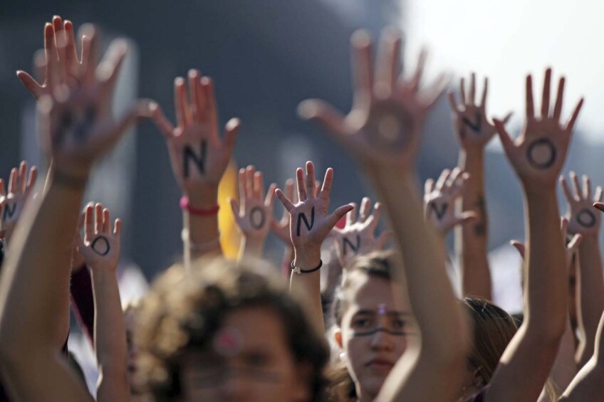 Zócalo and NHMLA present a discussion on the history of women in protest. In this photo, a group of women hold up their arms, showing the words "NO" printed on their palms during a protest march demanding non-sexist education and an end to discrimination,