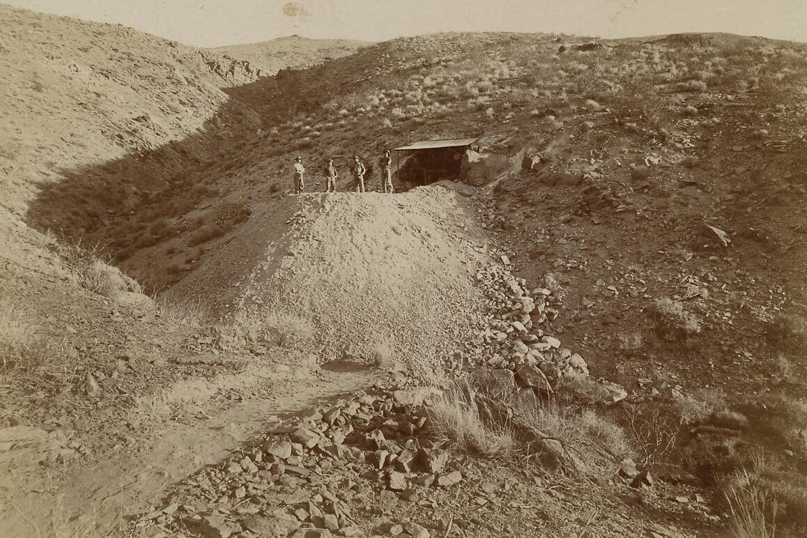 Four men at the Pitaluma Mine with the Yellow Aster and Rand Gulch in the background. | C. W. Tucker in 1897. California State Library collection.