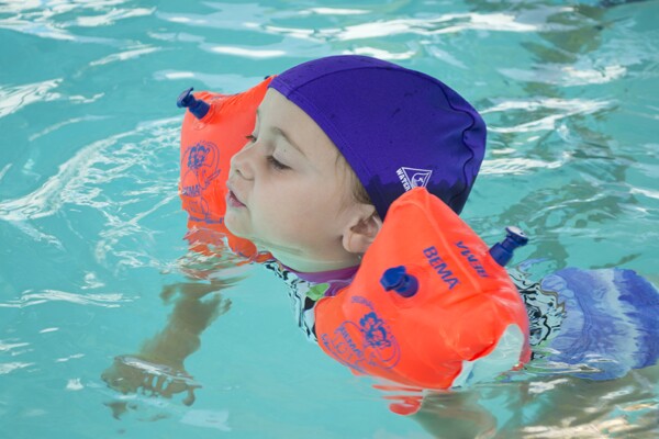 Student swimming with floaties | Photo by Sarah Silcox