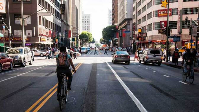 A biker riding through downtown Los Angeles. | Taylor Fitz-Gibbon