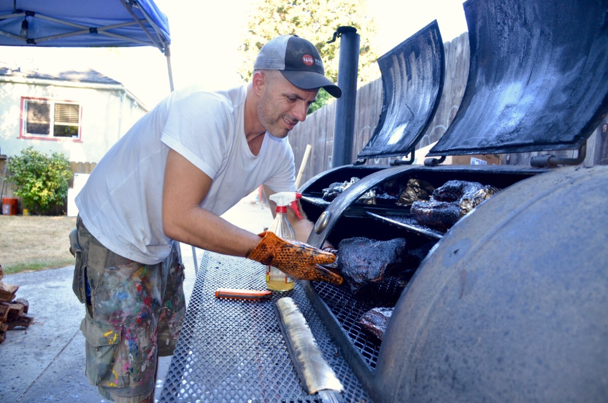 Burt Bakman tends his barbecue | Eddie Lin Trudy's Underground BBQ