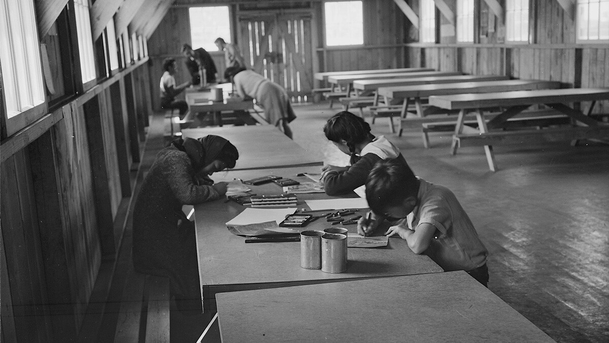 Evacuee children are remaining after hours to continue their creative work. | Dorothea Lange, War Relocation Authority Photographs of Japanese-American Evacuation and Resettlement / National Archives ABs10 MMD