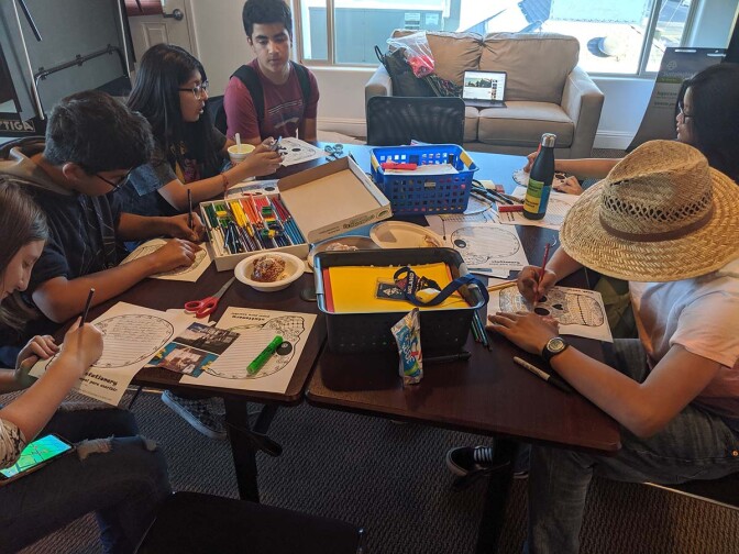 Californians for Justice leaders writing to loved ones that have passed away for Dias de Los Muertos. | Californians for Justice