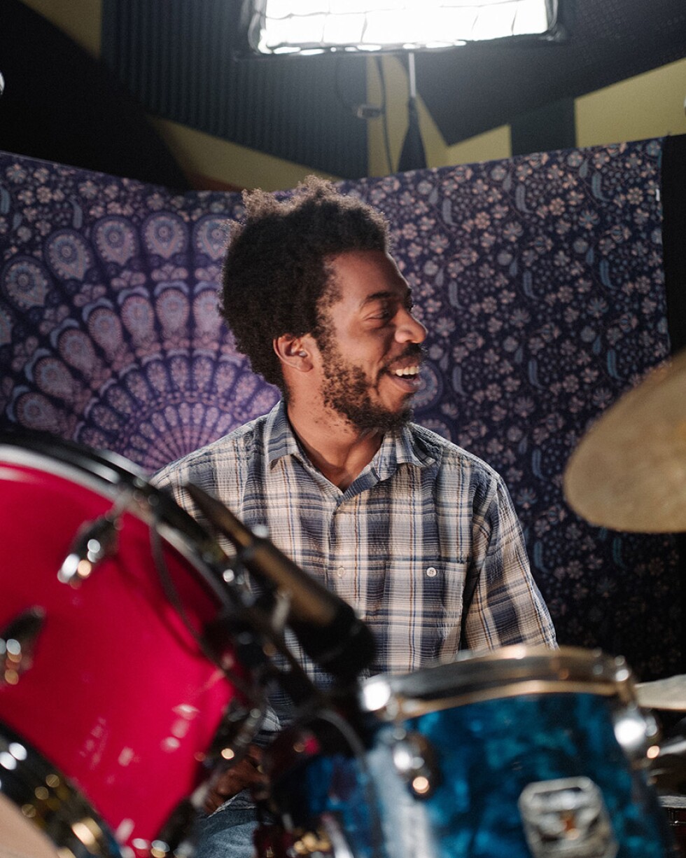 Mekala Session playing drums with a purple background | Samantha Lee "The New West Coast Sound: An L.A. Jazz Legacy" ab s11 episode image