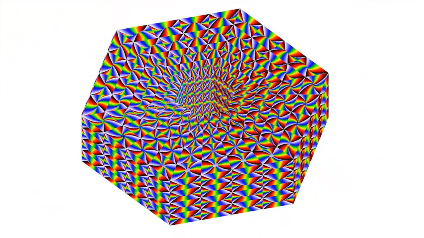 Still from Visible Cloaks video: multicolor abstract hexagonal shape