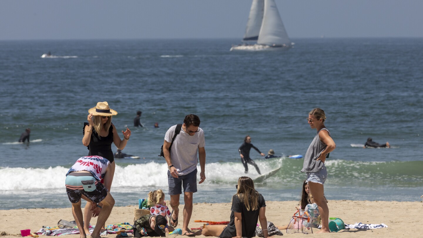 People lounge at the beach