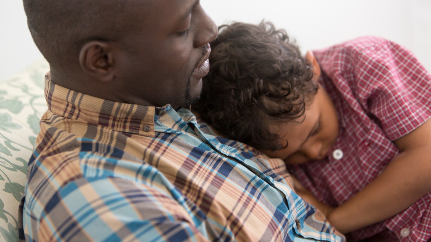 Father Comforting Upset Son