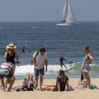 People lounge at the beach