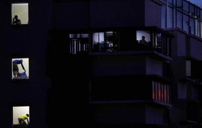 Migrant workers pray in their dormitory during the holy month of Ramadan, amid the coronavirus disease (COVID-19) outbreak, in Singapore May 8, 2020. Picture taken May 8, 2020.
