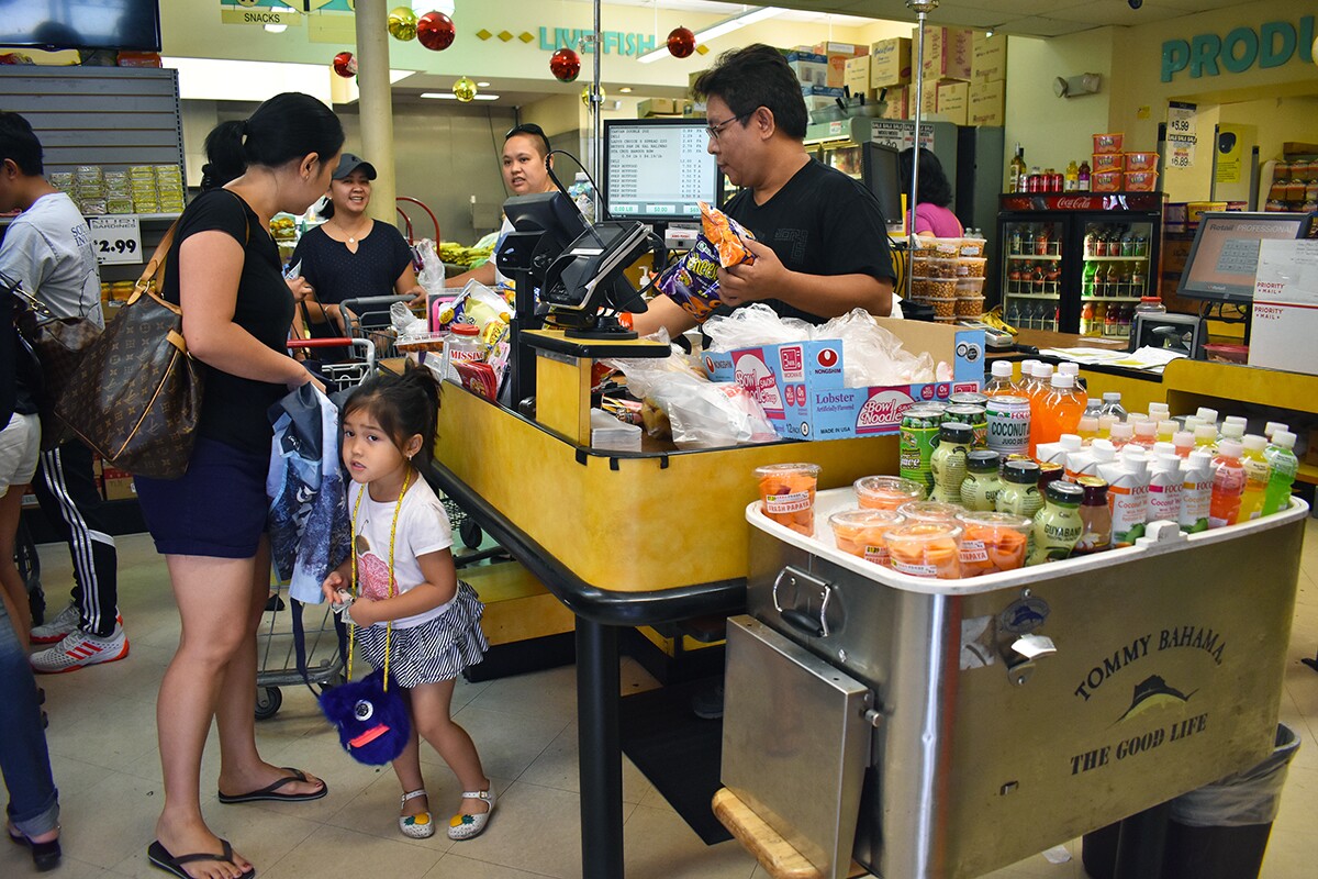 Customers waiting at the check out line. | Jacqueline Lee