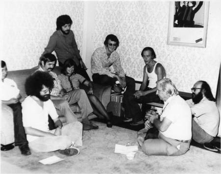 Left to right: John Platonia, Jim Kepner (moustache), Howard Fox (standing), June Herrle, Jim-Ed Thompson, Ralph Schaeffer, Morris Kight, Don Kilhefner (far right) and another person at the Gay Community Services Center, 1971. | Pat Rocco