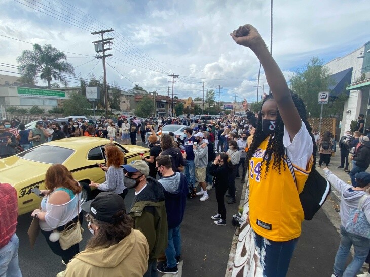In Silver Lake, revelers celebrate the news that Joe Biden and Kamala Harris have been declared the next president and vice-president of the U.S. on Saturday, Nov. 7, 2020. | Kyle Stokes/LAist