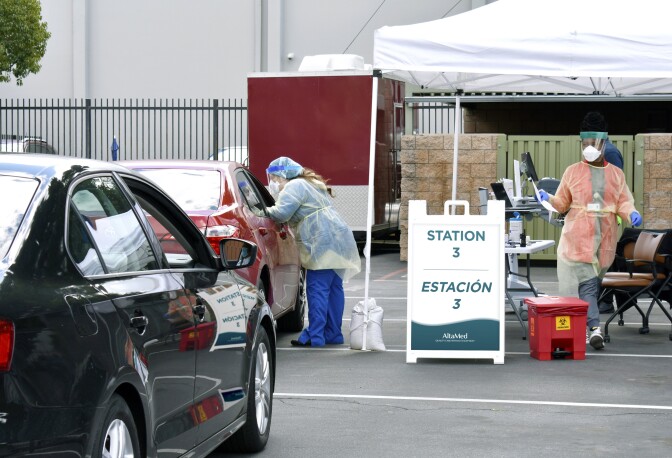 Health workers at a COVID-19 testing site in Commerce. | Courtesy of Altamed
