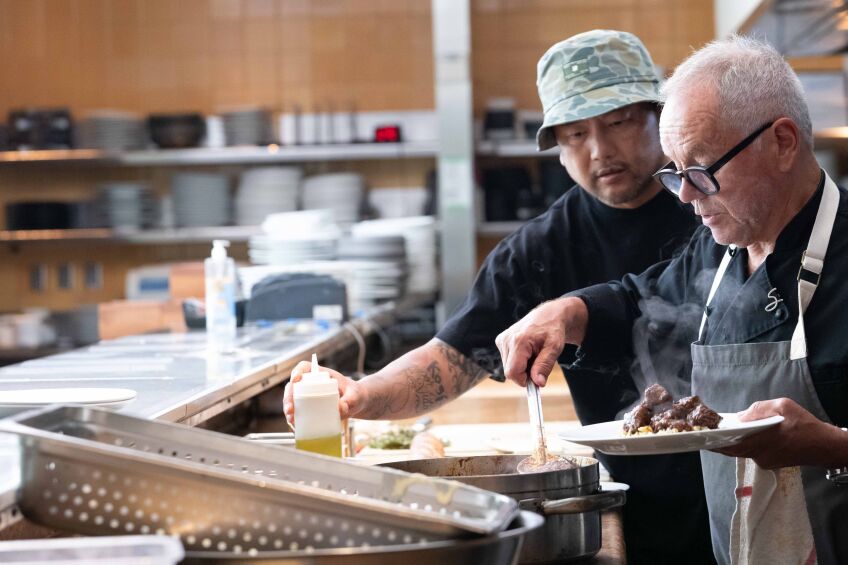 In the episode "The Future of Restaurants" Roy Choi breaks bread with Chef Wolfgang Puck. Photo credit: Stephen Vanasco