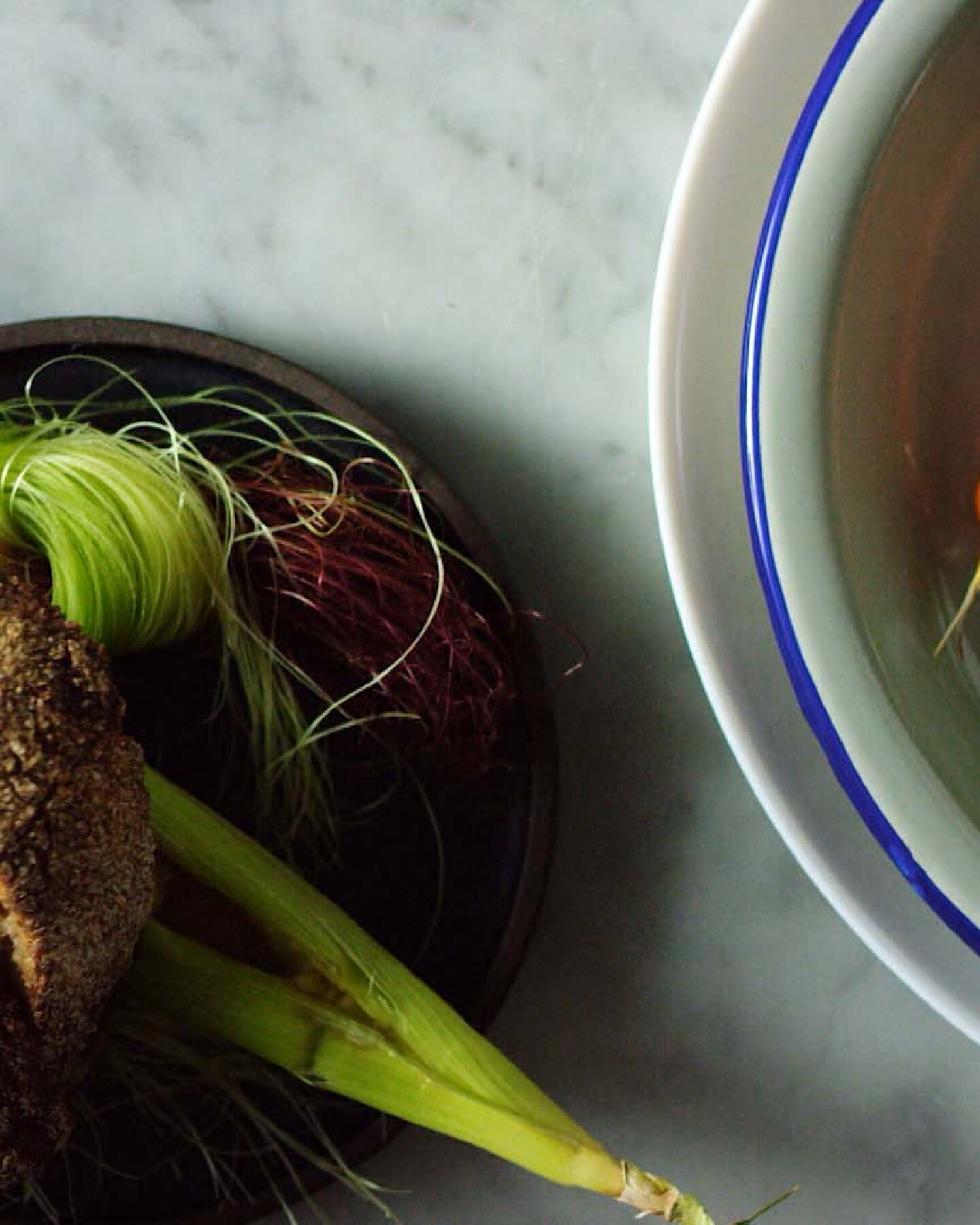 A meal prepared with local foraged plants. | Still from "Broken Bread"