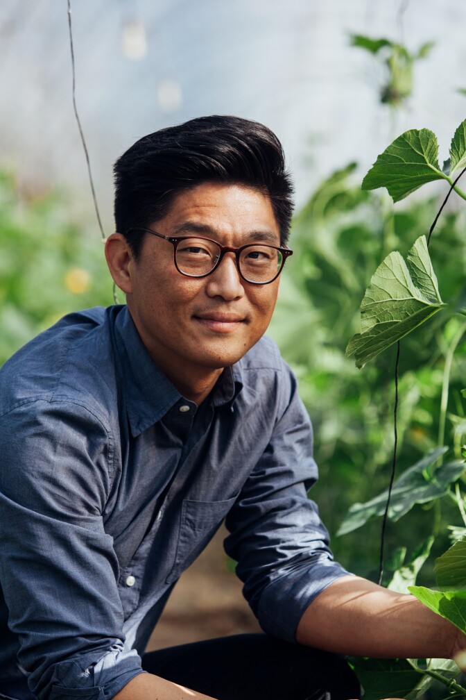 Aaron Choi smirks among his fields of crops in his California location of Girl & Dug Farm.